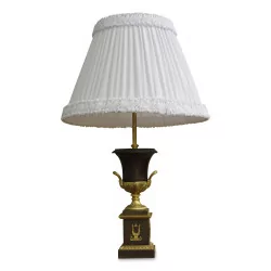 A Charles X lamp in burnished bronze and white lampshade