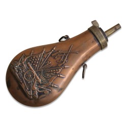 A brass and copper powder container.
