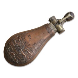 A brass and copper powder container.