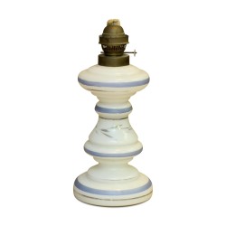 A kerosene lamp base in blue opaline and bench.