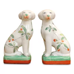 Une paire de chien en porcelaine “Delft” décor fleur.