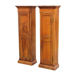 A pair of cabinets in Directoire walnut