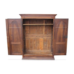A Vaudoise walnut cabinet on a plinth with a cornice