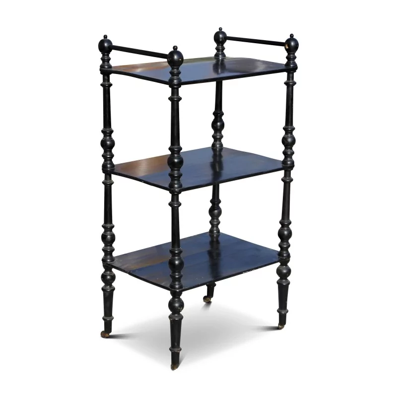A black turned wooden shelf on wheels. - Moinat - Bookshelves, Bookcases, Curio cabinets, Vitrines A black turned wooden shelf on wheels. - Moinat - Bookshelves, Bookcases, Curio cabinets, Vitrines
