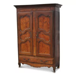 a walnut cabinet with two doors, a drawer