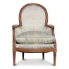 A Louis XVI gondola bergere in walnut - Moinat - Armchairs