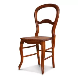 Four Louis Philippe cane chairs in walnut.