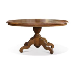 A Louis Philippe coffee table in walnut, tripod leg