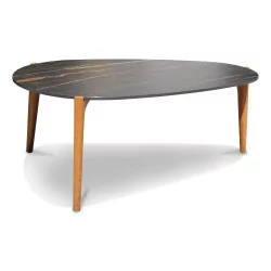 A tripod coffee table with ceramic top