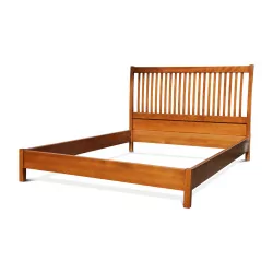 a walnut-stained beech bed including headboard