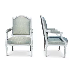 A pair of Louis XVI style armchairs