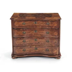 A walnut chest of drawers. Swiss