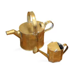 A pair of brass watering cans