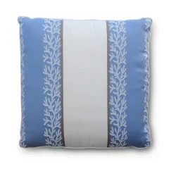 a square cushion covered in blue and white fabric