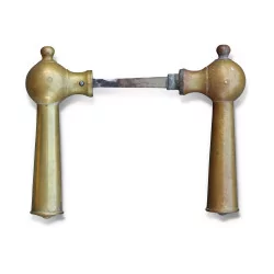A pair of brass door handles