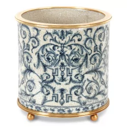 Un cache-pot bleu en porcelaine avec motifs végétal
