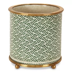 A green porcelain planter with patterns