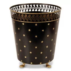 A wastepaper basket in black painted sheet metal