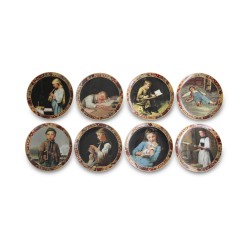 Un lot de huit assiettes "Scènes de vie"