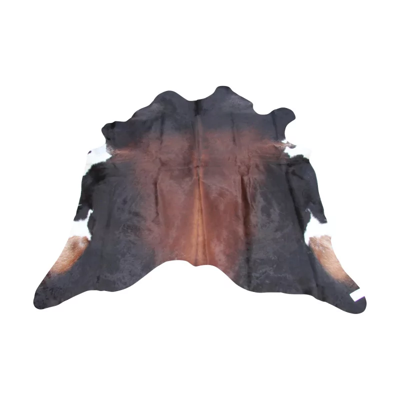 schwarzbrauner Kuhfell-Teppich auf weißem Grund, Modell … - Moinat - Teppiche