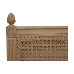 cane headboard in white painted wood with antique finish.