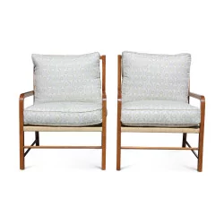 Two straw armchairs with printed cushions