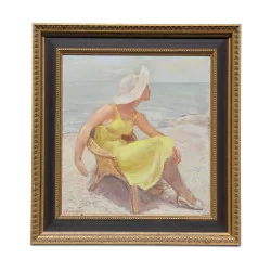 Une huile sur toile "Une femme assise sur la plage"