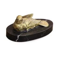 A bronze \"Lying bird\" signed Jules Moignez