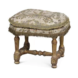 A Louis XIV stool in gilded wood, seat filled with cushions