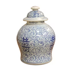 An ivory and blue porcelain herb pot