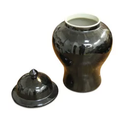 A black porcelain grass pot