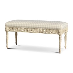 A carved solid wood bench