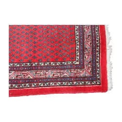 Tapis d’orient coloris bleu, rouge, noir et blanc avec