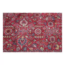 Large oriental rug in red tones.