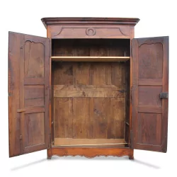A molded walnut cabinet with a wardrobe