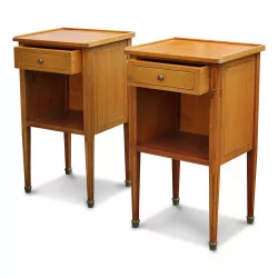 A pair of cherry bedside tables