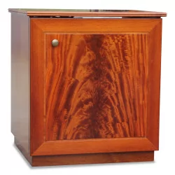 A chest of drawers in flamed mahogany