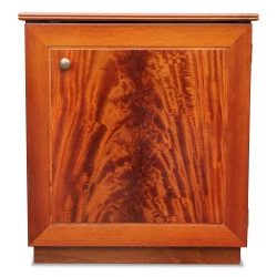 A chest of drawers in flamed mahogany
