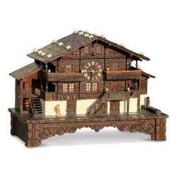 A wooden chalet with a music box