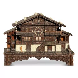A wooden chalet with a music box