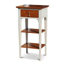 A glass of water drawer bedside table in cherry wood with gray body