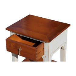 A glass of water drawer bedside table in cherry wood with gray body
