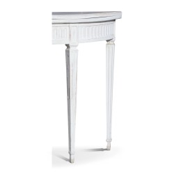 A pair of half-moon tables in white painted wood