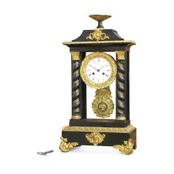 A clock decorated with gilded bronze
