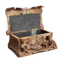 a \"Black Forest\" carved wooden jewelry box.