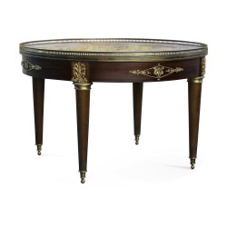 A small circular table, marble top
