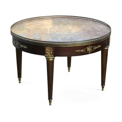 A small circular table, marble top