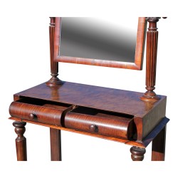 Un miroir mercure monté sur pivots en acajou, 2 tiroirs