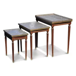 A set of three small mahogany tables