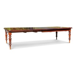 A mechanical extending mahogany table
